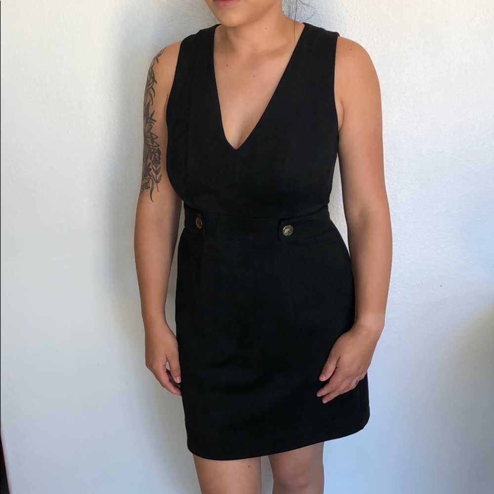V-neck black dress with gold buttons